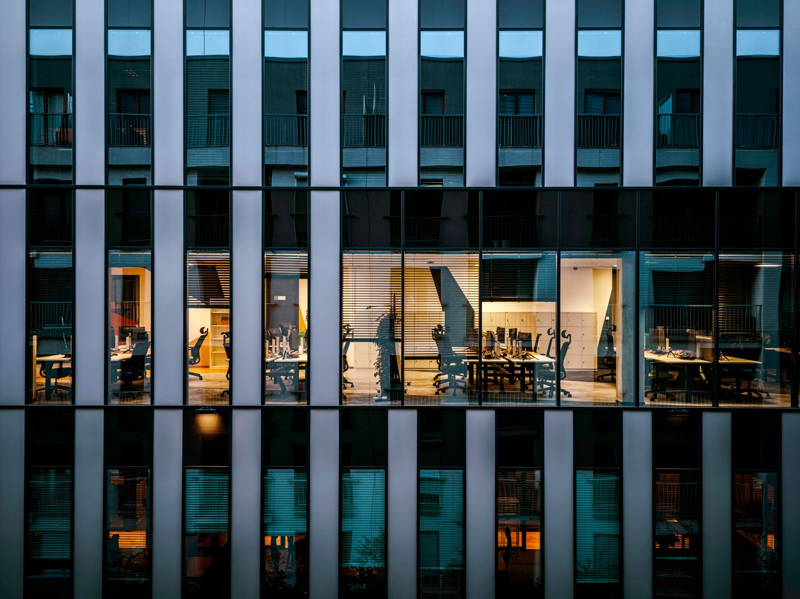 Modern office architecture and illuminated workspaces.