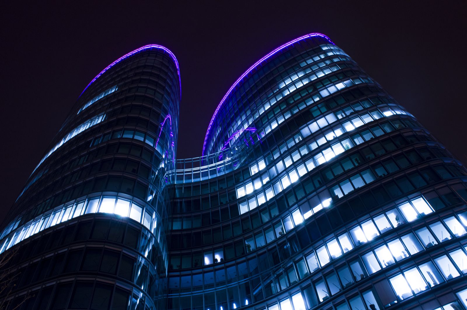 A modern skyline at night.